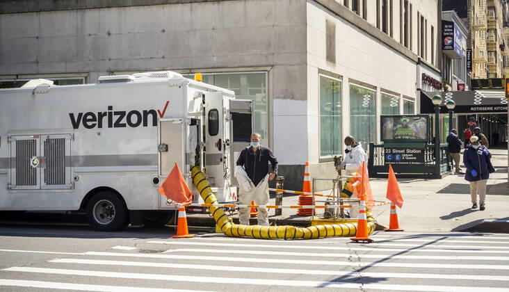 New York during the COVID-19 pandemic Verizon workers suit up in the Chelsea neighborhood in New York on Wednesday, April 15, 2020 during the COVID-19 pandemic. (  RichardxB.xLevine
