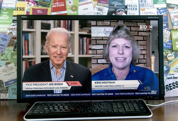 April 15, 2020 - Wilmington, Delaware, U.S. - A screen grab of Vice President JOE BIDEN as he speaks with KRIS HOLTHAM, a grocery clerk from Lansing, Michigan, during a virtual town hall with coronavirus pandemic front line workers. Wilmington U.S. - ZUMAce6_ 20200415_zaf_ce6_006 Copyright: xBrianxCahnx