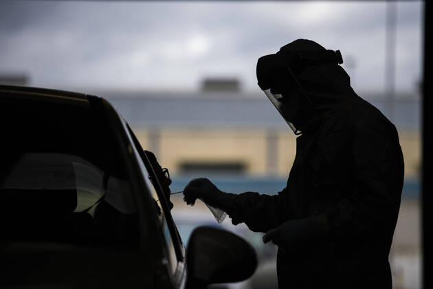 April 15, 2020, Granada, Spain: A health worker in a protective suit takes a sample for a PCR test..During the coronavirus crisis, at the ITV (technical inspection of vehicles) center in Albolote PCR tests (polymerase chain reaction) are carried out on workers of the security forces and staff of nursing homes to detect Covid 19. Granada Spain - ZUMAs197 20200415_zaa_s197_108 Copyright: xCarlosxGilx