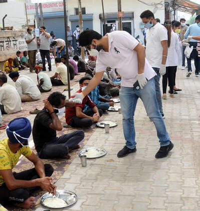PATIALA, INDIA - APRIL 15: Team of Doctors Screening the people before eating the Langar near Railway Station on April 15, 2020 in Patiala, India. (Photo by Bharat bhushan Hindustan Times) Government Provide Food To Homeless And Poor Amid Lockdown To Prevent Covid-19