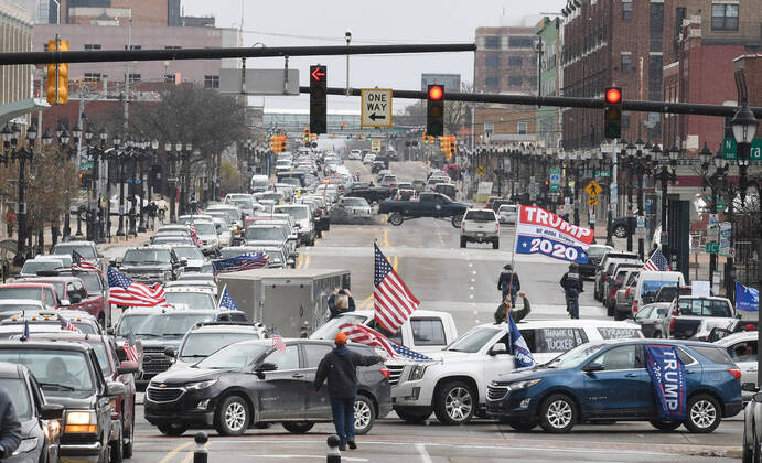 April 15, 2020, Lansing, Michigan, USA: Traffic lined up down Michigan Avenue heading west from I-127 to the State Capitol. Protestors, from their cars and on foot, surround the State Capitol during Operation Gridlock in Lansing, Mich. on Wednesday, April 15, 2020. Lansing USA - ZUMAm67_ 20200415_zaf_m67_003 Copyright: xDanielxMearsx