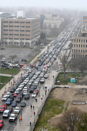 April 15, 2020, Lansing, Michigan, USA: Cars aren t moving at the corner of West Allegan Street and North Capitol Avenue as protestors, from their cars and on foot, surround the State Capitol during Operation Gridlock in Lansing, Mich. on Wednesday, April 15, 2020. Lansing USA - ZUMAm67_ 20200415_zaf_m67_005 Copyright: xDanielxMearsx