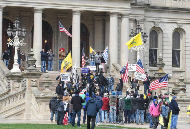 April 15, 2020, Lansing, Michigan, USA: A group of protestors on the steps of the Capital protest some of Gov. Gretchen Whitmer s new executive orders Wednesday, April 15, 2020 around noon. ..Prostestors, from their cars and on foot, surrounded the State Capitol during Operation Gridlock in Lansing, Mich. Lansing USA - ZUMAm67_ 20200415_zaf_m67_006 Copyright: xDanielxMearsx