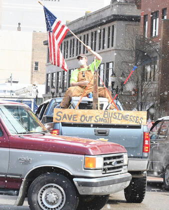April 15, 2020, Lansing, Michigan, USA: Protestors, from their cars and on foot, surround the State Capitol during Operation Gridlock in Lansing, Mich. on Wednesday, April 15, 2020. Lansing USA - ZUMAm67_ 20200415_zaf_m67_007 Copyright: xDanielxMearsx