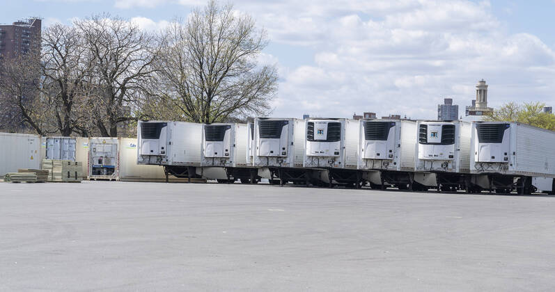Live in New York amid COVID-19 epidemic Dozens of refrigerated trucks and containers seen on Randall s Island prepared for influx of dead bodies as makeshift morgues amid COVID-19 pandemic New York New York United States Copyright: LevxRadin