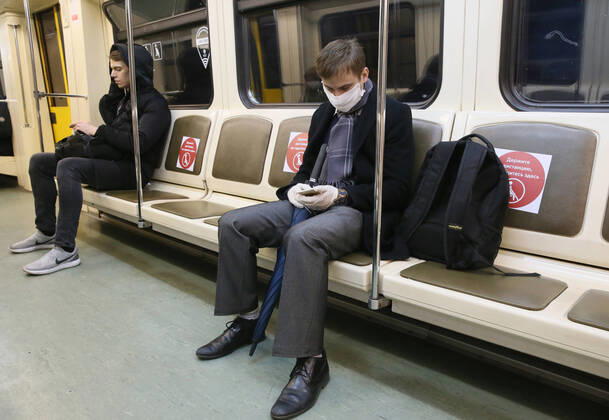 MOSCOW, RUSSIA - APRIL 16, 2020: People in a train at Shchyolkovskaya Station of the Moscow Metro amid the self-isolation regime. Vladimir Gerdo TASS  TS0D5EA5
