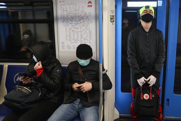 MOSCOW, RUSSIA - APRIL 16, 2020: People in a train at Vykhino Station of the Moscow Metro amid the self-isolation regime. Stanislav Krasilnikov TASS  TS0D5EE5