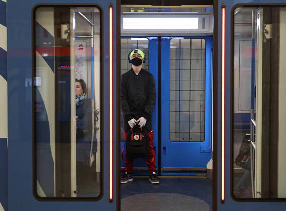 MOSCOW, RUSSIA - APRIL 16, 2020: People in a train at Vykhino Station of the Moscow Metro amid the self-isolation regime. Stanislav Krasilnikov TASS  TS0D5EE6