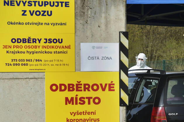 Paramedics take samples for covid-19 tests in drive-through testing station near the Domazlice Hospital, Czech Republic, on Wednesday, April 15, 2020. (CTKxPhoto MiroslavxChaloupka) CTKPhotoP202004150412101 cha004