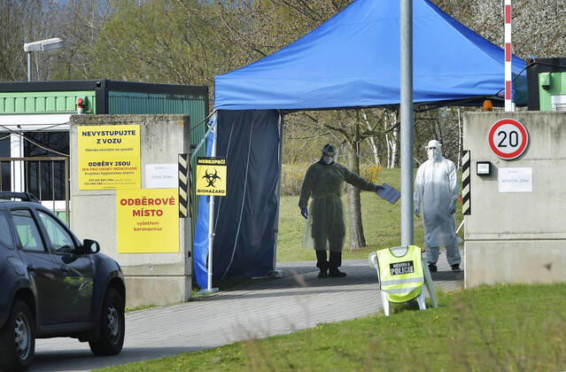 Paramedics take samples for covid-19 tests in drive-through testing station near the Domazlice Hospital, Czech Republic, on Wednesday, April 15, 2020. (CTKxPhoto MiroslavxChaloupka) CTKPhotoP202004150453401 cha008