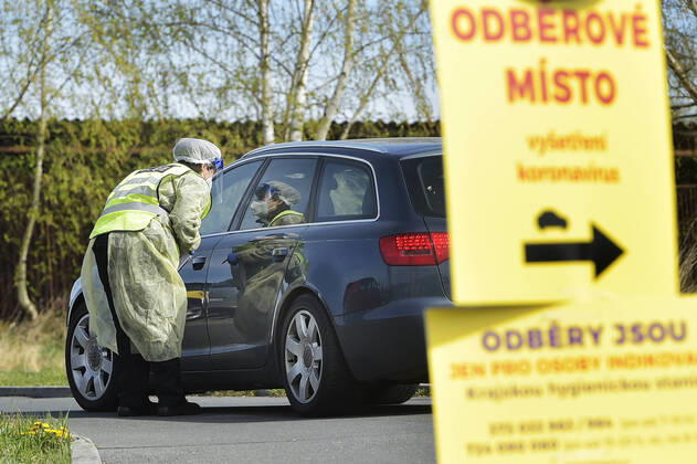 Paramedics take samples for covid-19 tests in drive-through testing station near the Domazlice Hospital, Czech Republic, on Wednesday, April 15, 2020. (CTKxPhoto MiroslavxChaloupka) CTKPhotoP202004150456601 cha014