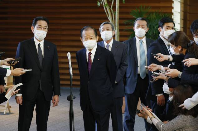 New coronavirus Japanese Liberal Democratic Party Secretary General Toshiro Nikai (2nd from L) and LDP policy chief Fumio Kishida (L) meet the press at the prime minister s office in Tokyo on April 16, 2020, after holding talks with Prime Minister Shinzo Abe over the proposed delivery of 100,000 yen in cash to all citizens to help them weather the fallout from the coronavirus pandemic. 
