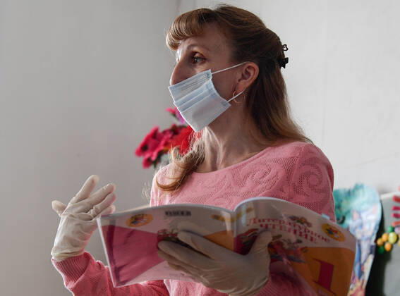 PRIMORYE TERRITORY, RUSSIA - APRIL 16, 2020: A literature teacher gives a lesson at No 8 Comprehensive School in the village of Nezhino, some 40 km north of Vladivostok. After moving to online schooling due to the COVID-19 pandemic, educational institutions in the Primorye Territory are switching back to classroom teaching, with underfilled schools being the first to welcome pupils. Yuri Smityuk TASS  TS0D5F1C
