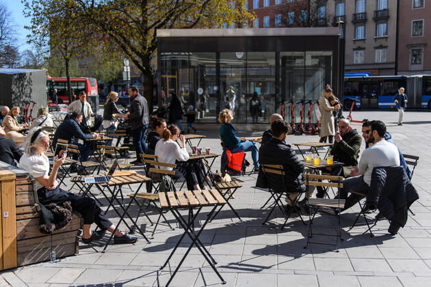 200415 People gather at a outdoor restaurant, as the coronavirus, COVID-19, outbreak continues on April 15, 2020 in Stockholm. Sweden stands out among countries in the world with so far comparatively very few public restrictions during the coronavirus pandemic. Photo: Maxim ThorÃ BILDBYRAN kod MT Copyright: MAXIMxTHORE BB200415BB030