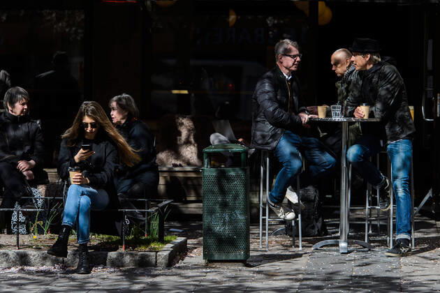 200415 People gather at a outdoor restaurant, as the coronavirus, COVID-19, outbreak continues on April 15, 2020 in Stockholm. Sweden stands out among countries in the world with so far comparatively very few public restrictions during the coronavirus pandemic. Photo: Maxim ThorÃ BILDBYRAN kod MT Copyright: MAXIMxTHORE BB200415BB034