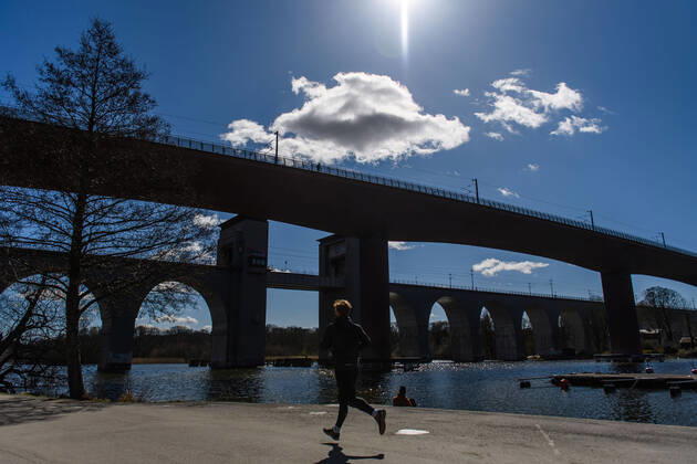 200415 A person is running in Tantolunden, as the coronavirus, COVID-19, outbreak continues on April 15, 2020 in Stockholm. Sweden stands out among countries in the world with so far comparatively very few public restrictions during the coronavirus pandemic. Photo: Maxim ThorÃ BILDBYRAN kod MT Copyright: MAXIMxTHORE BB200415BB064