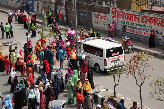 April 16, 2020: Female garments workers halt an ambulance and they do not allow to go due to not carrying patient, while they demonstrate to demand for due wages in front of their factory in South Kamlapur, Dhaka, Bangladesh; during the nationwide lockdown of the coronavirus (Covid-19) pandemic. Their garment factory had been closed for a period of time since 25, March2020 for their health issue due to the coronavirus pandemic. - ZUMAa186 20200416_zip_a186_001 Copyright: xShafayetxHossainxApollox
