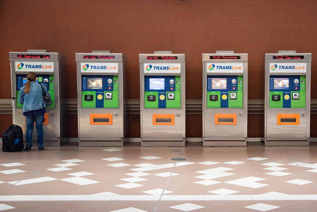 April 16, 2020, Queensland, Australia: A woman is seen at a ticket vending machine at an empty train station during Coronavirus crisis..Australian states including Queensland take strict new lockdown rules to stop the spread of Covid-19. Queensland Australia - ZUMAs197 20200416_zaa_s197_004 Copyright: xFlorentxRolsx