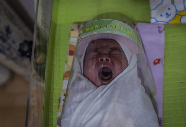 April 16, 2020, Bireuen, Aceh, Indonesia: A newborn baby wearing a face shield as a protective measure amid fears of coronavirus disease COVID-19 at a hospital in Bireuen, Aceh province. Latest reports of COVID-19 cases, Indonesian confirms 5.516 positive cases, 548 recovered with 496 deaths. Bireuen Indonesia - ZUMAm250 20200416_zip_m250_010 Copyright: xZikrixMaulanax