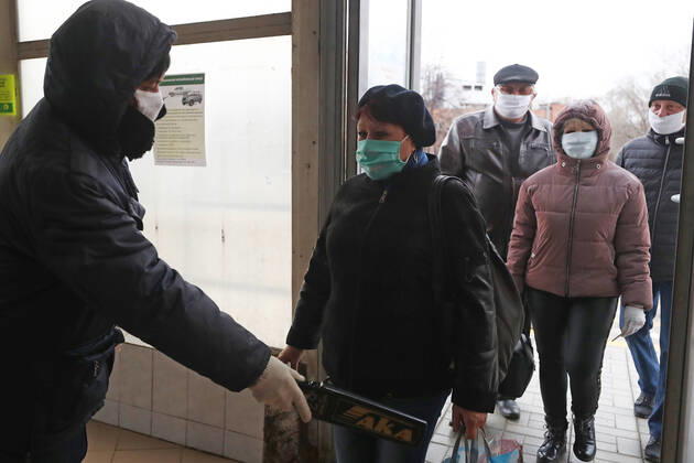 ULYANOVSK, RUSSIA - APRIL 16, 2020: Employees enter the UAZ Ulyanovsk Automobile Plant, a subsidiary of Sollers. UAZ has resumed operation since April 13 in compliance with sanitary regulations; according to a decree by the Ulyanovsk Region government, not more than 25% of the staff, engineering personnel, and office workers are to continue working remotely. Yegor Aleyev TASS  TS0D6037
