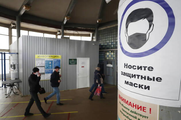 ULYANOVSK, RUSSIA - APRIL 16, 2020: Employees enter the UAZ Ulyanovsk Automobile Plant, a subsidiary of Sollers. UAZ has resumed operation since April 13 in compliance with sanitary regulations; according to a decree by the Ulyanovsk Region government, not more than 25% of the staff, engineering personnel, and office workers are to continue working remotely. Yegor Aleyev TASS  TS0D6038