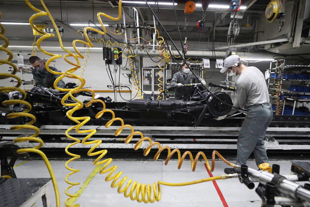 ULYANOVSK, RUSSIA - APRIL 16, 2020: Employees by the main conveyor in a shop at the UAZ Ulyanovsk Automobile Plant, a subsidiary of Sollers. UAZ has resumed operation since April 13 in compliance with sanitary regulations; according to a decree by the Ulyanovsk Region government, not more than 25% of the staff, engineering personnel, and office workers are to continue working remotely. Yegor Aleyev TASS  TS0D6050