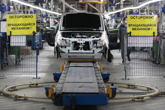 ULYANOVSK, RUSSIA - APRIL 16, 2020: Assembling a car in a shop at the UAZ Ulyanovsk Automobile Plant, a subsidiary of Sollers. UAZ has resumed operation since April 13 in compliance with sanitary regulations; according to a decree by the Ulyanovsk Region government, not more than 25% of the staff, engineering personnel, and office workers are to continue working remotely. Yegor Aleyev TASS  TS0D6054