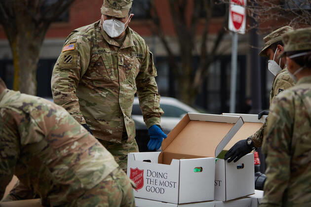 April 16, 2020, Chelsea, Massachusetts, US: The Massachusetts National Guard has responded to the COVID-19, Corona Virus, situation in Chelsea, Massachusetts. Chelsea is a major hot spot, and the hardest hit city in the state. Chelsea is a Latin American immigrant heavy population with 80% of the population being essential workers, such as grocery clerks. The National Guard hands out food to local residents with donations from the Salvation Army. Chelsea US - ZUMAd211 20200416_zap_d211_002 Copyright: xAllisonxDinnerx