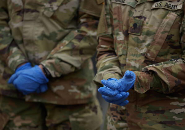 April 16, 2020, Chelsea, Massachusetts, US: The Massachusetts National Guard has responded to the COVID-19, Corona Virus, situation in Chelsea, Massachusetts. Chelsea is a major hot spot, and the hardest hit city in the state. Chelsea is a Latin American immigrant heavy population with 80% of the population being essential workers, such as grocery clerks. The National Guard hands out food to local residents with donations from the Salvation Army. Chelsea US - ZUMAd211 20200416_zap_d211_007 Copyright: xAllisonxDinnerx
