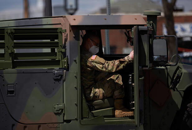 April 16, 2020, Chelsea, Massachusetts, US: The Massachusetts National Guard has responded to the COVID-19, Corona Virus, situation in Chelsea, Massachusetts. Chelsea is a major hot spot, and the hardest hit city in the state. Chelsea is a Latin American immigrant heavy population with 80% of the population being essential workers, such as grocery clerks. The National Guard hands out food to local residents with donations from the Salvation Army. Chelsea US - ZUMAd211 20200416_zap_d211_009 Copyright: xAllisonxDinnerx