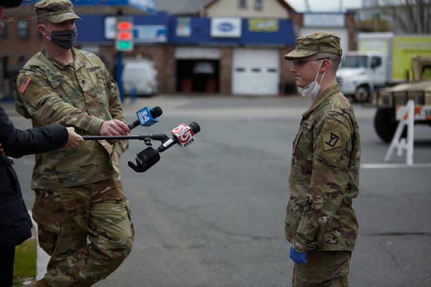 April 16, 2020, Chelsea, Massachusetts, US: The Massachusetts National Guard has responded to the COVID-19, Corona Virus, situation in Chelsea, Massachusetts. Chelsea is a major hot spot, and the hardest hit city in the state. Chelsea is a Latin American immigrant heavy population with 80% of the population being essential workers, such as grocery clerks. The National Guard hands out food to local residents with donations from the Salvation Army. Chelsea US - ZUMAd211 20200416_zap_d211_013 Copyright: xAllisonxDinnerx