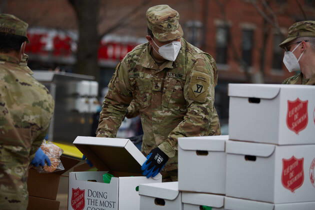 April 16, 2020, Chelsea, Massachusetts, US: The Massachusetts National Guard has responded to the COVID-19, Corona Virus, situation in Chelsea, Massachusetts. Chelsea is a major hot spot, and the hardest hit city in the state. Chelsea is a Latin American immigrant heavy population with 80% of the population being essential workers, such as grocery clerks. The National Guard hands out food to local residents with donations from the Salvation Army. Chelsea US - ZUMAd211 20200416_zap_d211_018 Copyright: xAllisonxDinnerx
