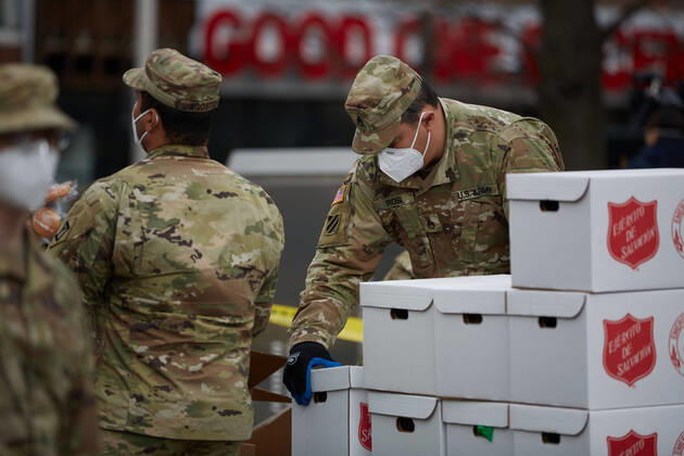 April 16, 2020, Chelsea, Massachusetts, US: The Massachusetts National Guard has responded to the COVID-19, Corona Virus, situation in Chelsea, Massachusetts. Chelsea is a major hot spot, and the hardest hit city in the state. Chelsea is a Latin American immigrant heavy population with 80% of the population being essential workers, such as grocery clerks. The National Guard hands out food to local residents with donations from the Salvation Army. Chelsea US - ZUMAd211 20200416_zap_d211_020 Copyright: xAllisonxDinnerx