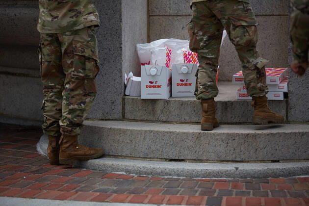 April 16, 2020, Chelsea, Massachusetts, US: The Massachusetts National Guard has responded to the COVID-19, Corona Virus, situation in Chelsea, Massachusetts. Chelsea is a major hot spot, and the hardest hit city in the state. Chelsea is a Latin American immigrant heavy population with 80% of the population being essential workers, such as grocery clerks. The National Guard hands out food to local residents with donations from the Salvation Army. Chelsea US - ZUMAd211 20200416_zap_d211_014 Copyright: xAllisonxDinnerx