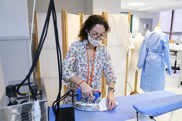 April 16, 2020, Madrid, Spain: A volunteer irons some of the materials used for making protective face masks at Rey Juan Carlos University in Madrid..A group of teachers at Rey Juan Carlos University volunteer in making face masks and medical gowns to supply hospitals and nursing homes in need of them. Madrid Spain - ZUMAs197 20200416_zaa_s197_162 Copyright: xLeganxP.xMacex