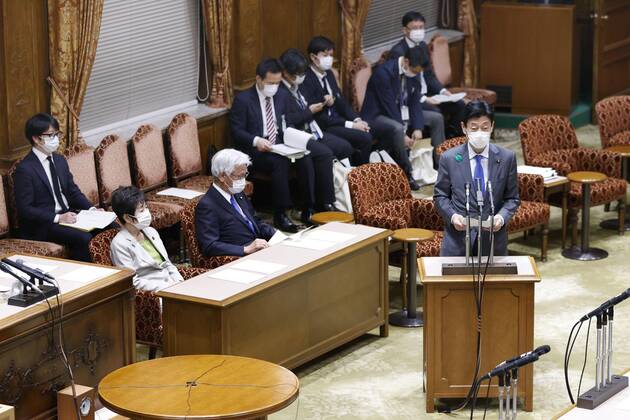 Japan s economic and fiscal policy minister Nishimura Yasutoshi Nishimura, the minister in charge of economic and fiscal policy, speaks about the coronavirus pandemic at a parliamentary session in Tokyo on April 16, 2020. Japanese Prime Minister Shinzo Abe expanded the same day the state of emergency beyond Tokyo, Osaka and five other prefectures to the entire nation in an attempt to prevent the coronavirus from spreading further. 