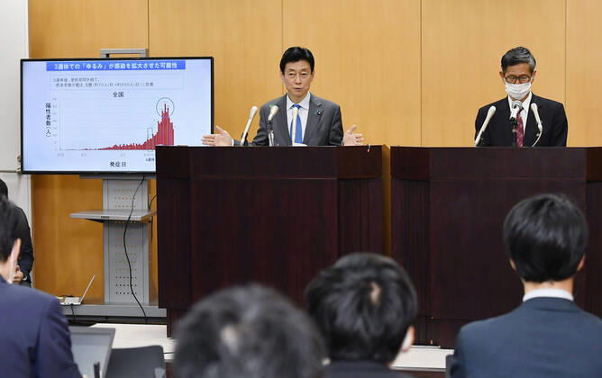 Japan s fight against coronavirus Yasutoshi Nishimura (L), the minister in charge of economic and fiscal policy, and the Japan Community Healthcare Organization s Shigeru Omi, a member of the Japanese government panel of experts working on measures against the coronavirus, attend a press conference in Tokyo on April 16, 2020. Japanese Prime Minister Shinzo Abe expanded the same day the state of emergency beyond Tokyo, Osaka and five other prefectures to the entire nation in an attempt to prevent the coronavirus from spreading further. 