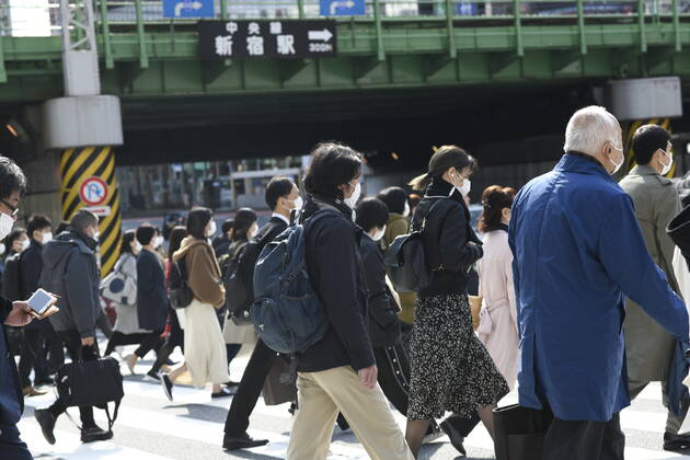 TOKYO, JAPAN - APRIL 17: Commuters wearing face mask head to work early morning in Shinjuku, Tokyo on Friday, April 17, 2020. The Japanese government decided to expand the current areas under a state of emergency to nationwide, as the Covid-19 coronavirus outbreak continues to spread throughout the country. (Photo: Richard Atrero de Guzman AFLO) (125423270)