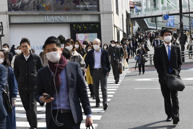 TOKYO, JAPAN - APRIL 17: Commuters wearing face mask head to work early morning in Shinjuku, Tokyo on Friday, April 17, 2020. The Japanese government decided to expand the current areas under a state of emergency to nationwide, as the Covid-19 coronavirus outbreak continues to spread throughout the country. (Photo: Richard Atrero de Guzman AFLO) (125423365)