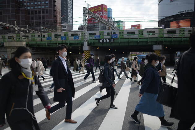 TOKYO, JAPAN - APRIL 17: Commuters wearing face mask head to work early morning in Shinjuku, Tokyo on Friday, April 17, 2020. The Japanese government decided to expand the current areas under a state of emergency to nationwide, as the Covid-19 coronavirus outbreak continues to spread throughout the country. (Photo: Richard Atrero de Guzman AFLO) (125423443)