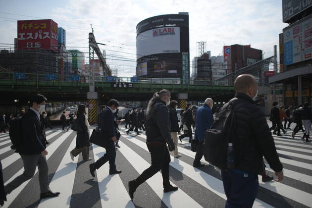 TOKYO, JAPAN - APRIL 17: Commuters wearing face mask head to work early morning in Shinjuku, Tokyo on Friday, April 17, 2020. The Japanese government decided to expand the current areas under a state of emergency to nationwide, as the Covid-19 coronavirus outbreak continues to spread throughout the country. (Photo: Richard Atrero de Guzman AFLO) (125423649)
