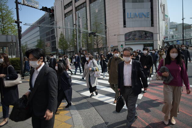 TOKYO, JAPAN - APRIL 17: Commuters wearing face mask head to work early morning in Shinjuku, Tokyo on Friday, April 17, 2020. The Japanese government decided to expand the current areas under a state of emergency to nationwide, as the Covid-19 coronavirus outbreak continues to spread throughout the country. (Photo: Richard Atrero de Guzman AFLO) (125423716)
