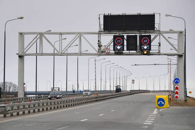 VLADIVOSTOK, RUSSIA - APRIL 17, 2020: A deserted Russky Bridge between mainland Vladivostok and Russky Island in Russia s Far East during the pandemic of the novel coronvirus disease (COVID-19). Vladivostok s traffic police have set up a checkpoint at the approach to the bridge to stop vehicles and see if drivers and cyclists have permission to travel to Russky Island during the lockdown. Vladivostok s authorities have restricted access to Russky Island and a few smaller islands -- popular weekend retreats -- to prevent people from violating lockdown measures. Only those who live, work or study on the islands are allowed to travel. Since 31 March 2020, the Primorye Territory, including Vladivostok, has been on lockdown to counter the spread of the infection. As of 17 April 2020, the Primorye Territory (including Vladivostok) has reported  TS0D6110