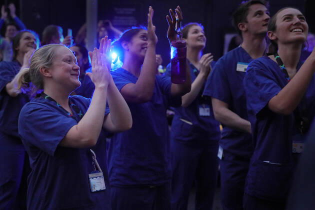 (200417) -- LONDON, April 17, 2020 (Xinhua) -- Medical workers applaud outside Chelsea and Westminster Hospital during the weekly clap for the NHS (National Health Service) in London, Britain on April 16, 2020. (Photo by Tim Ireland Xinhua) BRITAIN-LONDON-COVID-19-NHS-CLAPPING 
