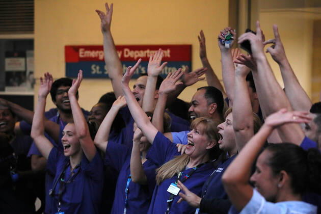 (200417) -- LONDON, April 17, 2020 (Xinhua) -- Medical workers applaud outside Chelsea and Westminster Hospital during the weekly clap for the NHS (National Health Service) in London, Britain on April 16, 2020. (Photo by Tim Ireland Xinhua) BRITAIN-LONDON-COVID-19-NHS-CLAPPING 