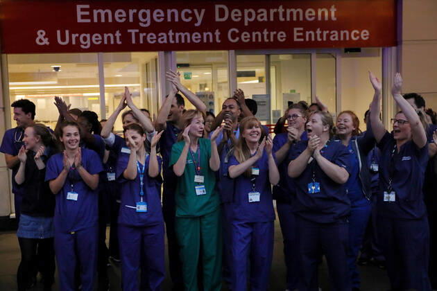 (200417) -- LONDON, April 17, 2020 (Xinhua) -- Medical workers applaud outside Chelsea and Westminster Hospital during the weekly clap for the NHS (National Health Service) in London, Britain on April 16, 2020. (Photo by Tim Ireland Xinhua) BRITAIN-LONDON-COVID-19-NHS-CLAPPING 