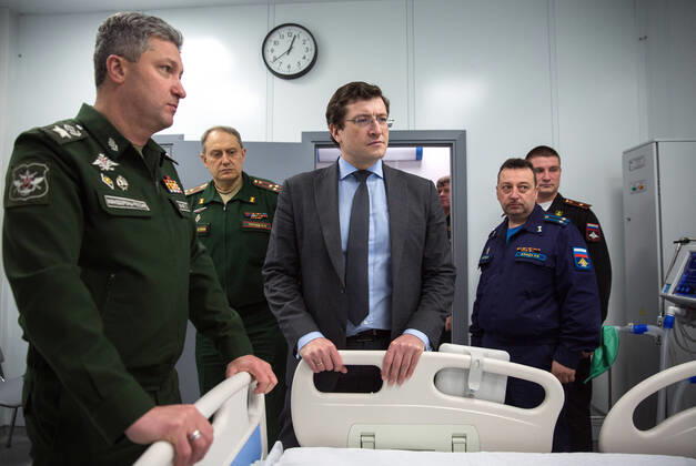 NIZHNY NOVGOROD, RUSSIA - APRIL 17, 2020: Russia s Deputy Minister of Defence Timur Ivanov (L) and Nizhny Novgorod Region Governor Gleb Nikitin attend the opening ceremony of a multipurpose medical centre for coronavirus patients constructed at army hospital No 422 of the Russian Defence Ministry; the Russian Defence Ministry is building 16 infectious disease centres for COVID-19 patients in various Russian cities; the centres under construction in Odintsovo, Podolsk, Volgograd, Novosibirsk, Orenburg, Ulan-Ude, and Ussuriysk are slated for completion by the end of April. Mikhail Solunin TASS  TS0D61B6