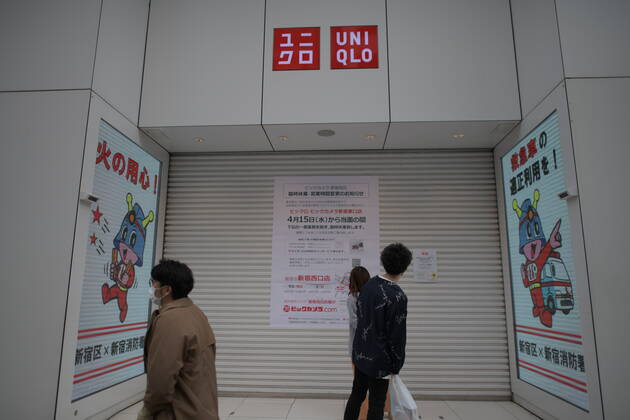 TOKYO, JAPAN - APRIL 17: Commuters wearing face mask stand in front of a close store in Shinjuku, Tokyo on Friday, April 17, 2020. The Japanese government decided to expand the current areas under a state of emergency to nationwide, as the Covid-19 coronavirus outbreak continues to spread throughout the country. (Photo: Richard Atrero de Guzman AFLO) (125447538)