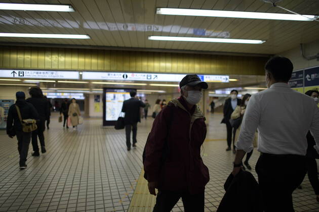 TOKYO, JAPAN - APRIL 17: Commuters wearing face mask head to their destination in Tokyo on Friday, April 17, 2020. The Japanese government decided to expand the current areas under a state of emergency to nationwide, as the Covid-19 coronavirus outbreak continues to spread throughout the country. (Photo: Richard Atrero de Guzman AFLO) (125447583)