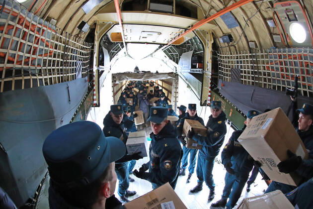 (200417) -- MINSK, April 17, 2020 (Xinhua) -- Soldiers unload Chinese humanitarian aid at an airport in Minsk, Belarus, April 17, 2020. A military transport plane loaded with Chinese humanitarian aid arrived here from Beijing on Friday morning. The special flight, arranged by the Belarusian embassy in China, delivered 32 tons of humanitarian goods to Belarus, including rapid test kits, respirators, medical masks, pulse oximeters, medical protective suits, goggles, infrared thermometers and disposable medical gloves. (Photo by Henadz Zhinkov Xinhua) BELARUS-MINSK-CHINA-AID-ARRIVAL